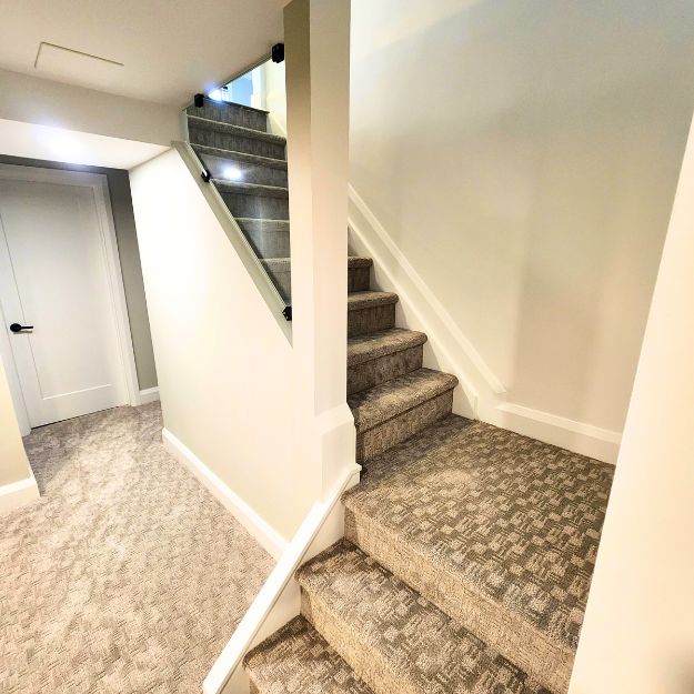 Stairs down to a basement apartment renovation project.