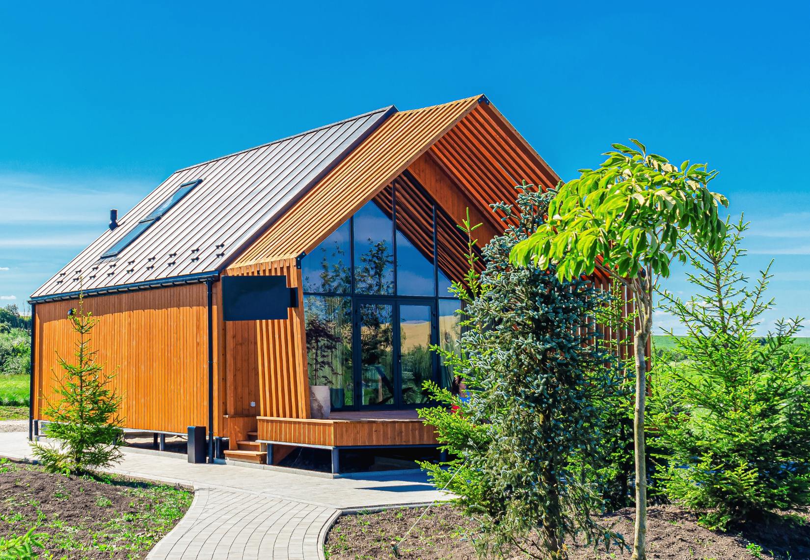 Modern coach home with natural wood and A-frame roof in Ottawa, Canada.