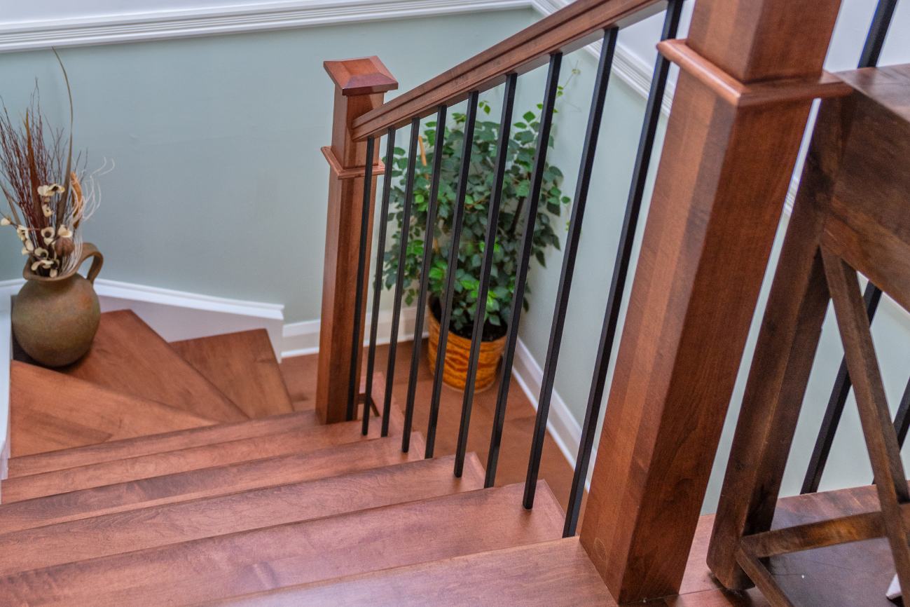 Shot of renovated hardwood stairsase and baniseter from top.