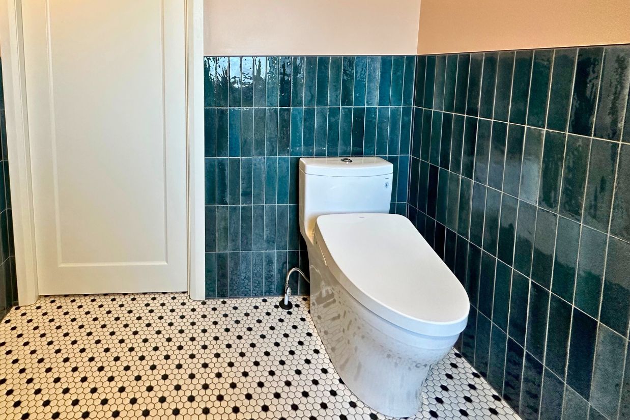 Toilet area in renovated Hintonburg bathroom.