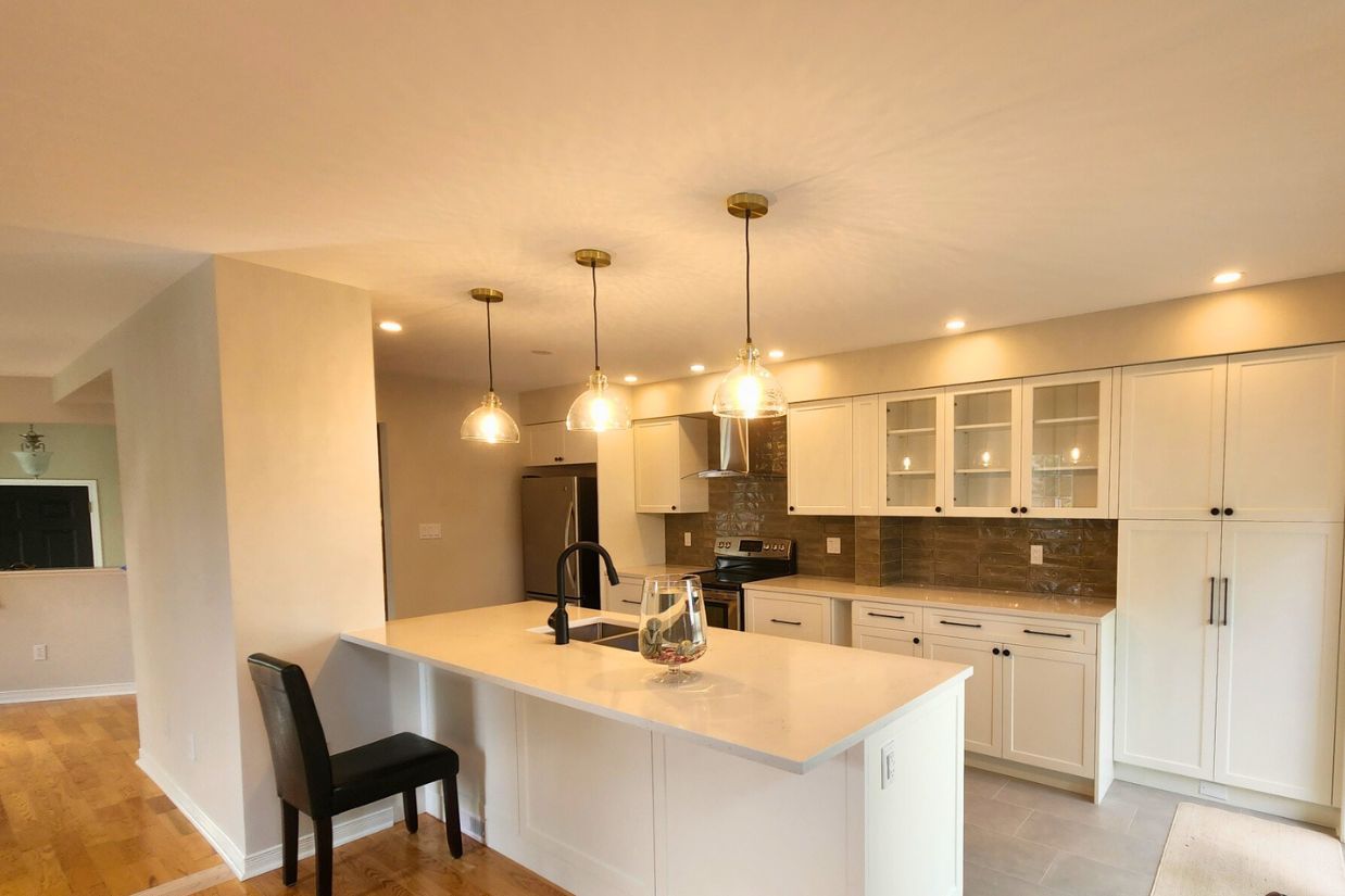 Modern white kitchen shot from dining area.