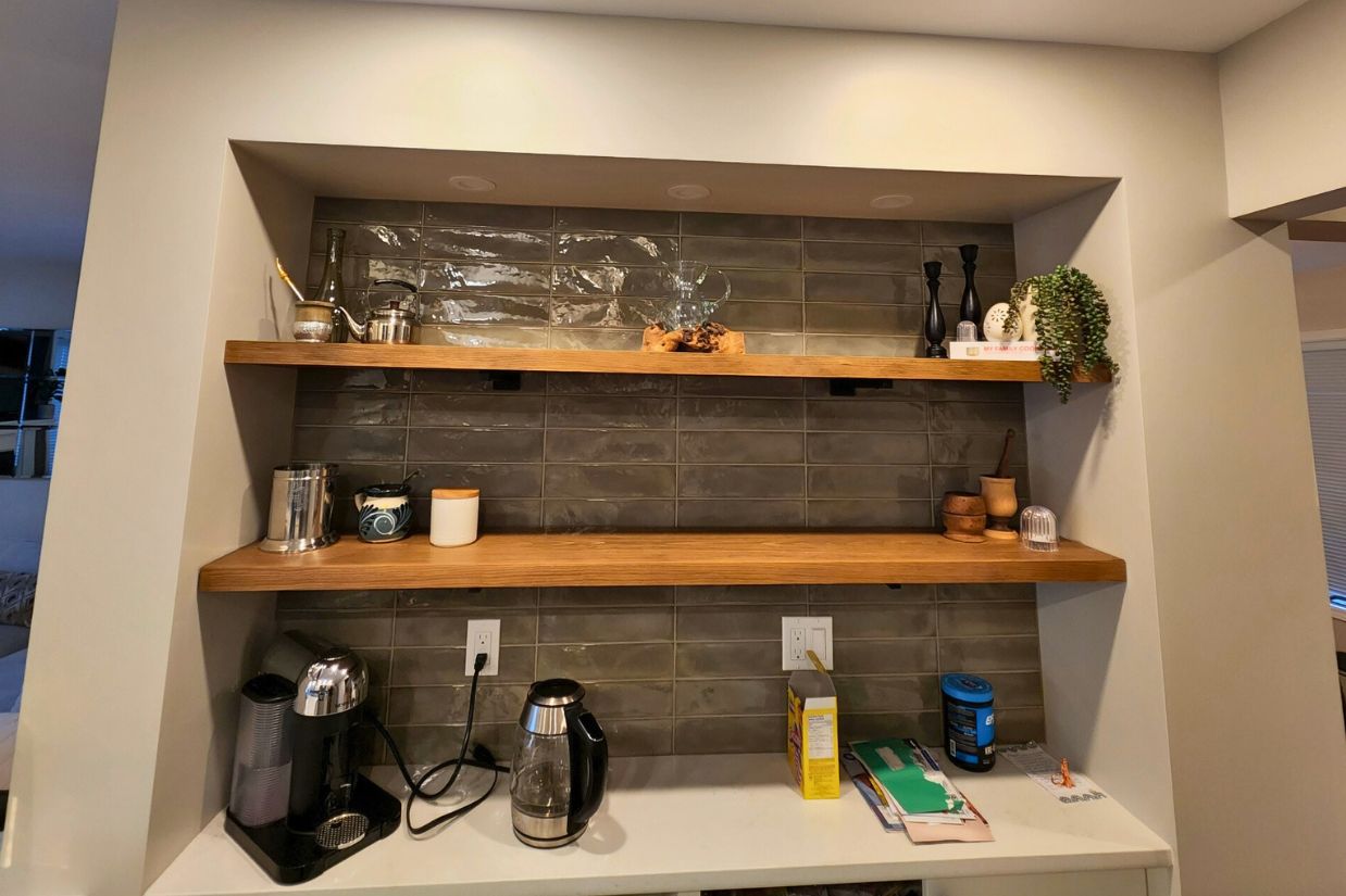 Built-in shelving in a butler bar area of a kitchen renovation project.