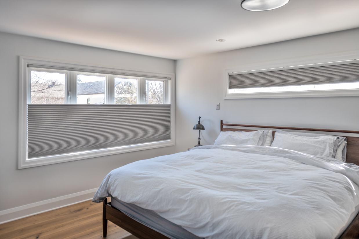 Renovated master bedroom with privacy windows.