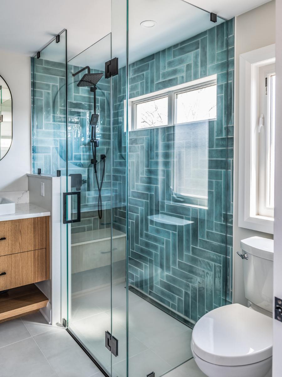 Glass encased standup shower in renovated Westboro home.