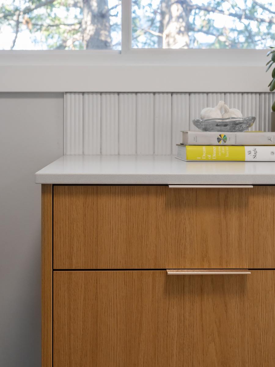 Close up of countertop, cabinet and backsplash work.