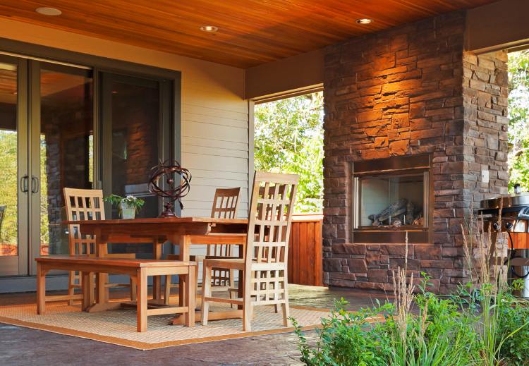 Outdoor living space in Ottawa complete with fireplace and stonework.